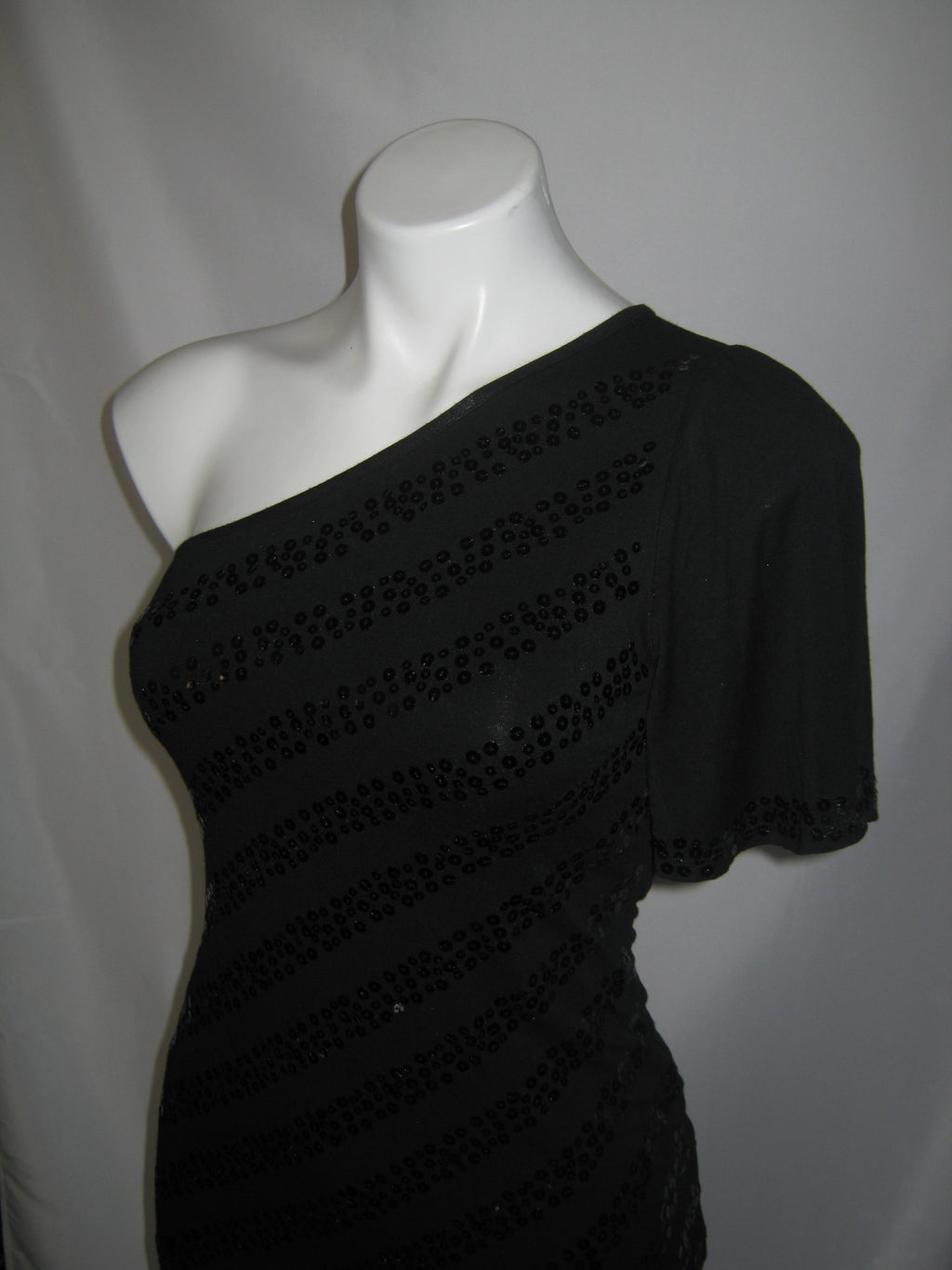 BEBE Obsidian One-Shoulder Sequin Top